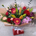 large florist choice bouquet red orange pink peach lily roses